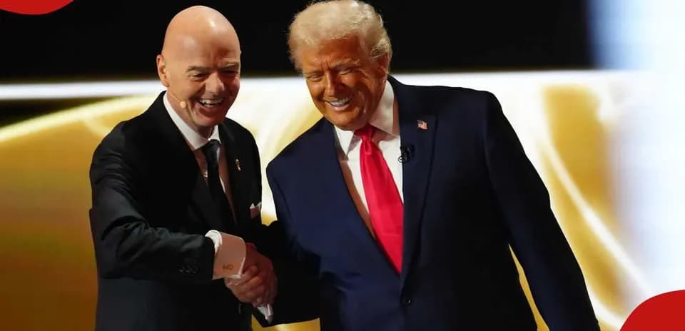 Two men shaking hands on stage at event