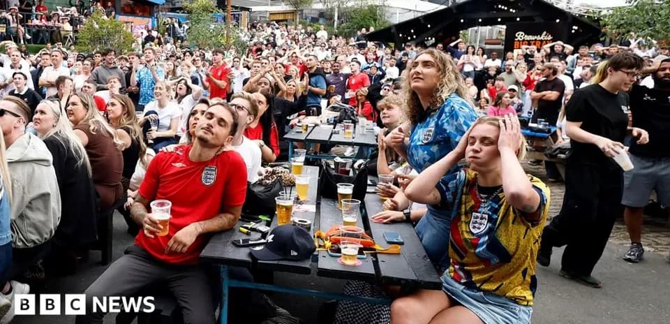 Crowd watching football match at outdoor venue