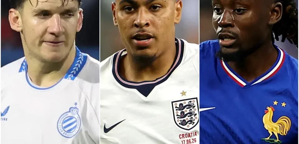 Three football players in team jerseys during match