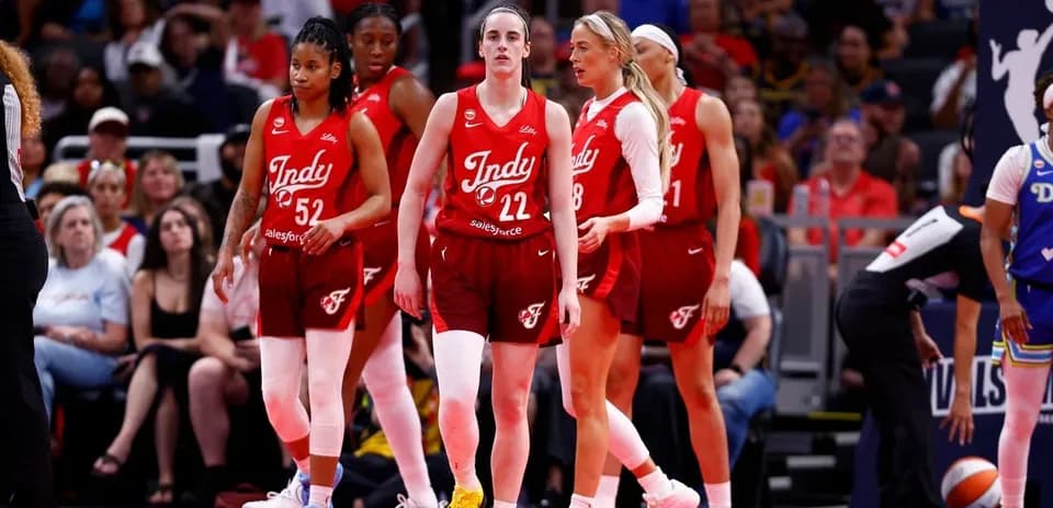 Indy team players walking on the court during game
