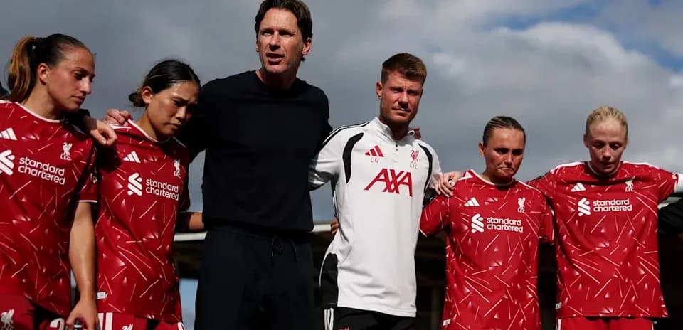 Liverpool women's team gathered for a team huddle