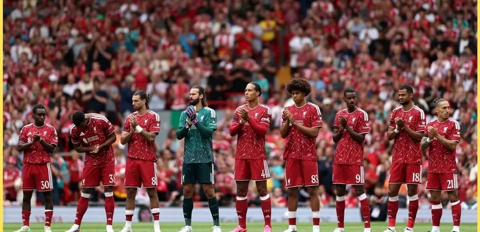 Liverpool players lined up and applauding fans