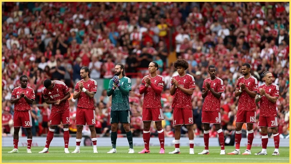 Liverpool players lined up and applauding fans