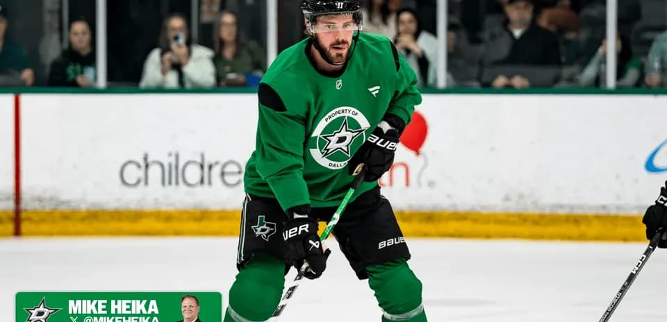Hockey player practicing on ice rink wearing green jersey