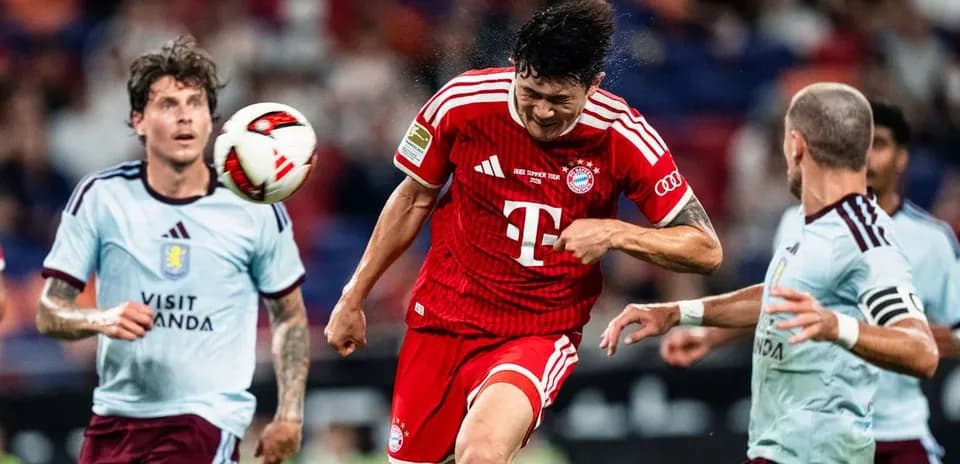 Bayern Munich player heading ball during match