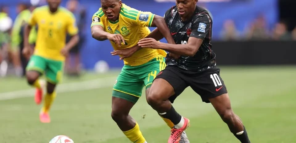 Two players competing for the ball during match
