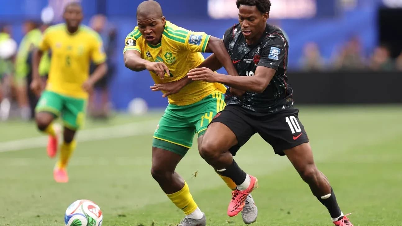 Two players competing for the ball during match