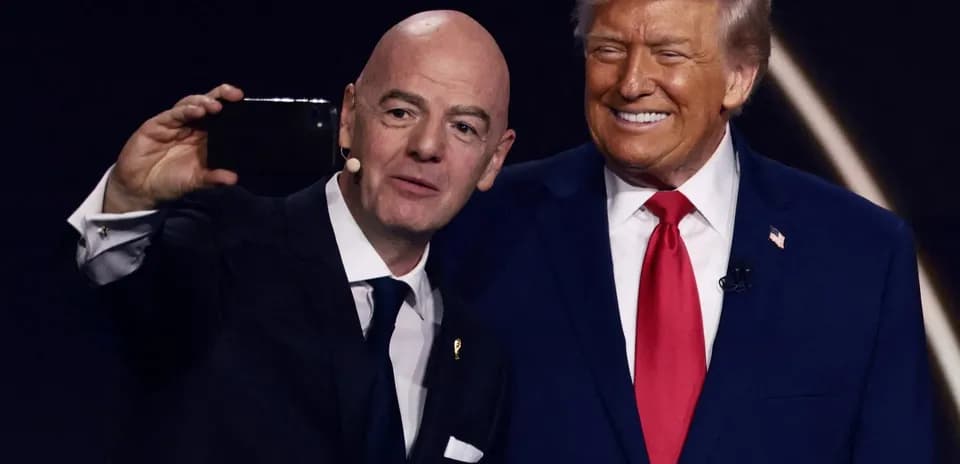 Two men taking a selfie at an event