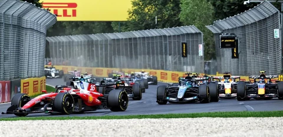 Formula 1 cars racing on a circuit track