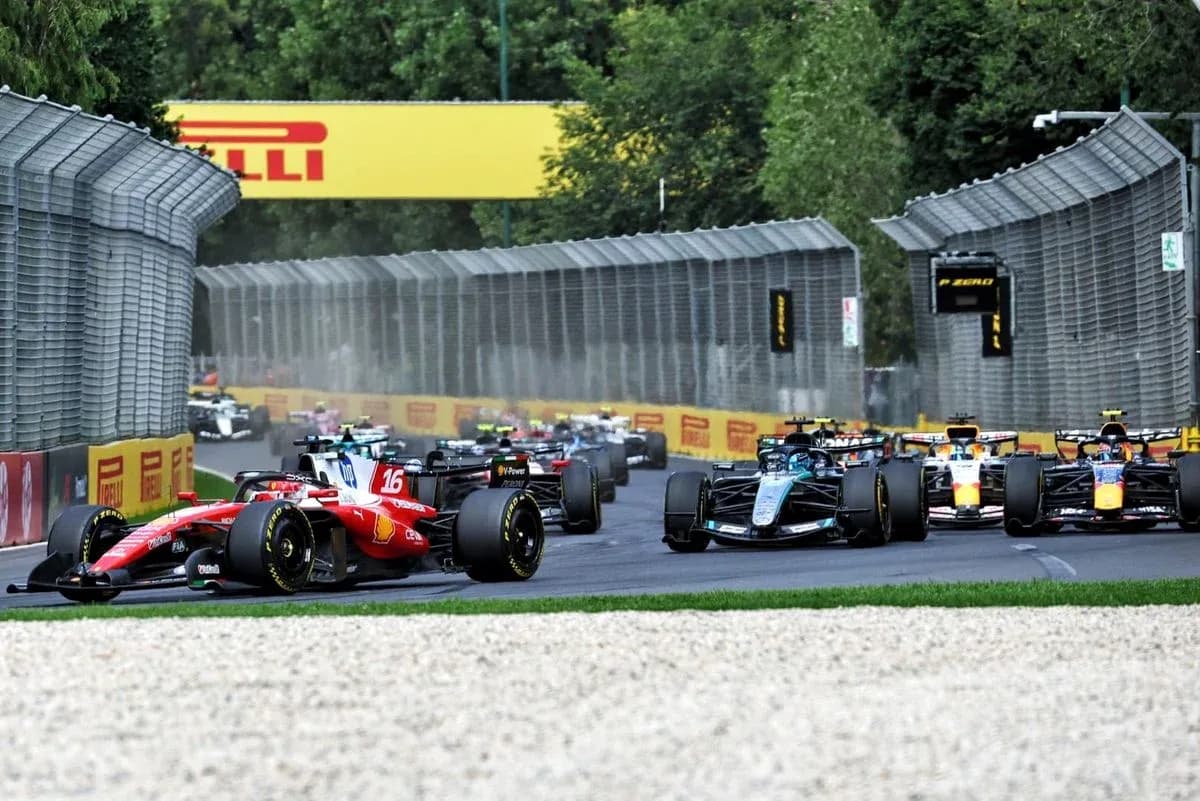 Formula 1 cars racing on a circuit track