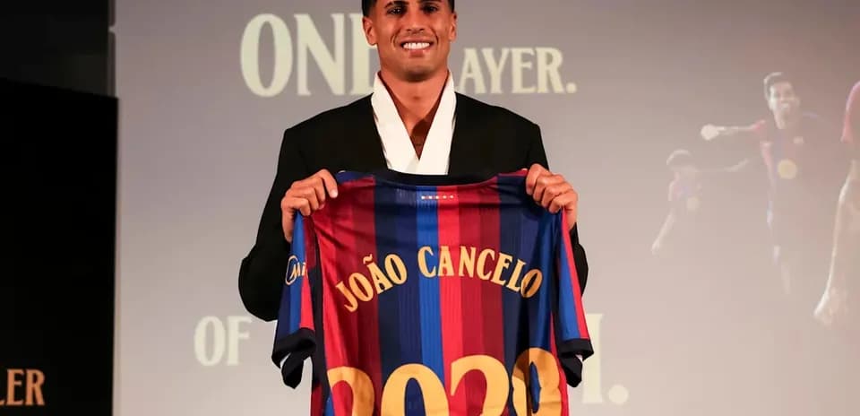 João Cancelo presenting Barcelona jersey at event