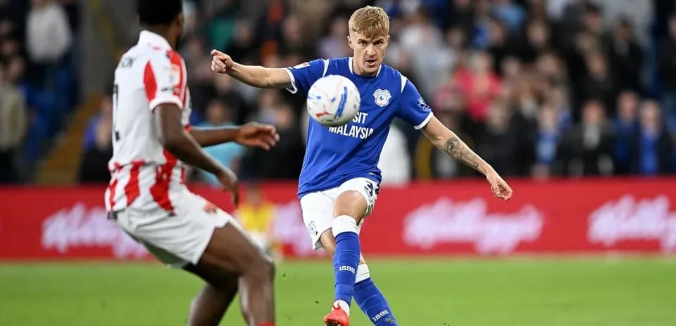 Cardiff City player shooting the ball during match