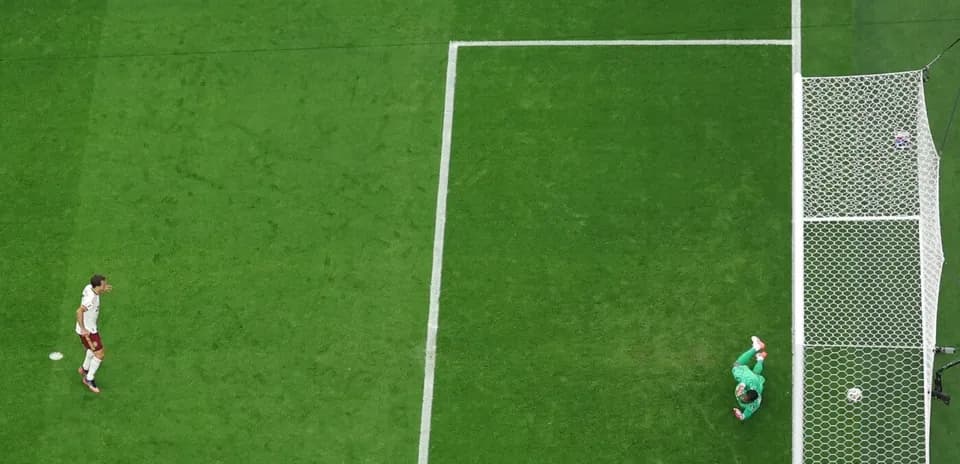 Goalkeeper diving to save a shot on goal