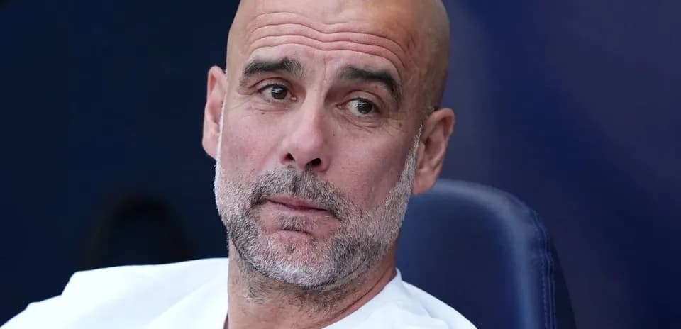 Bald man with beard sitting on bench