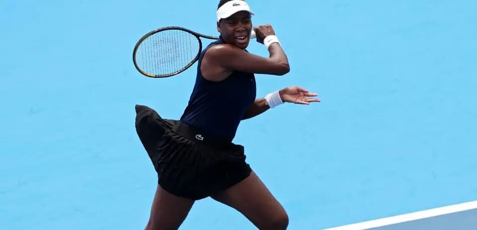 Tennis player hitting a backhand on court