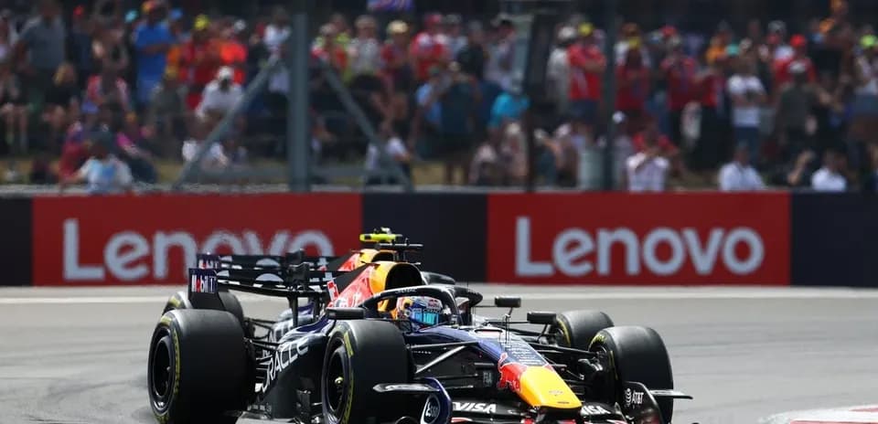 Formula 1 car racing on track with spectators