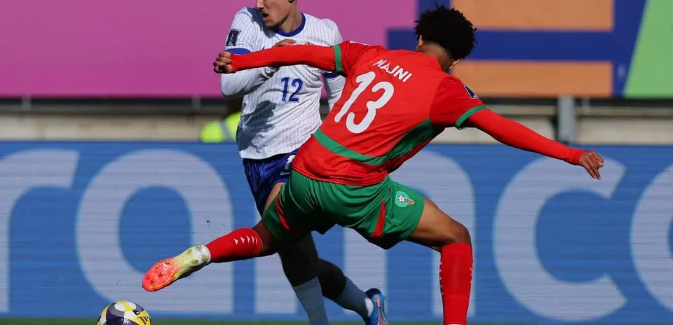 Two players competing for the ball during match