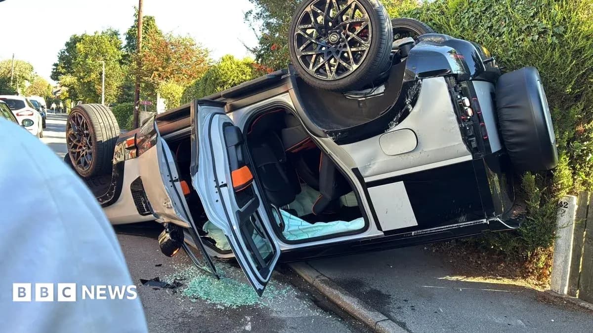 Upside down car on the side of the road