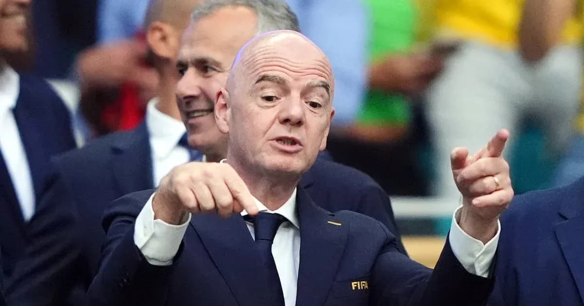FIFA official speaking at event with audience behind