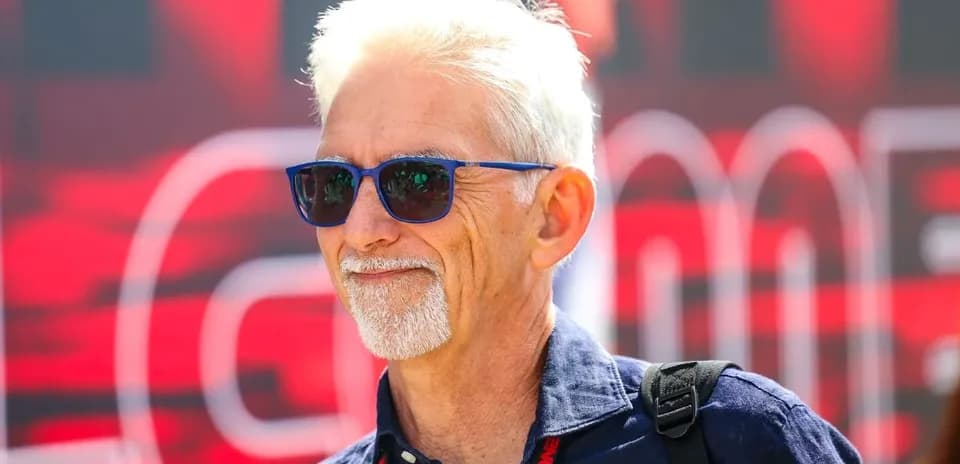 Man wearing sunglasses at sporting event venue