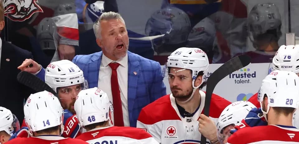 Coach giving instructions to players during timeout