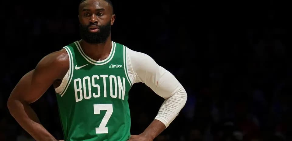 Basketball player in Boston Celtics jersey on court