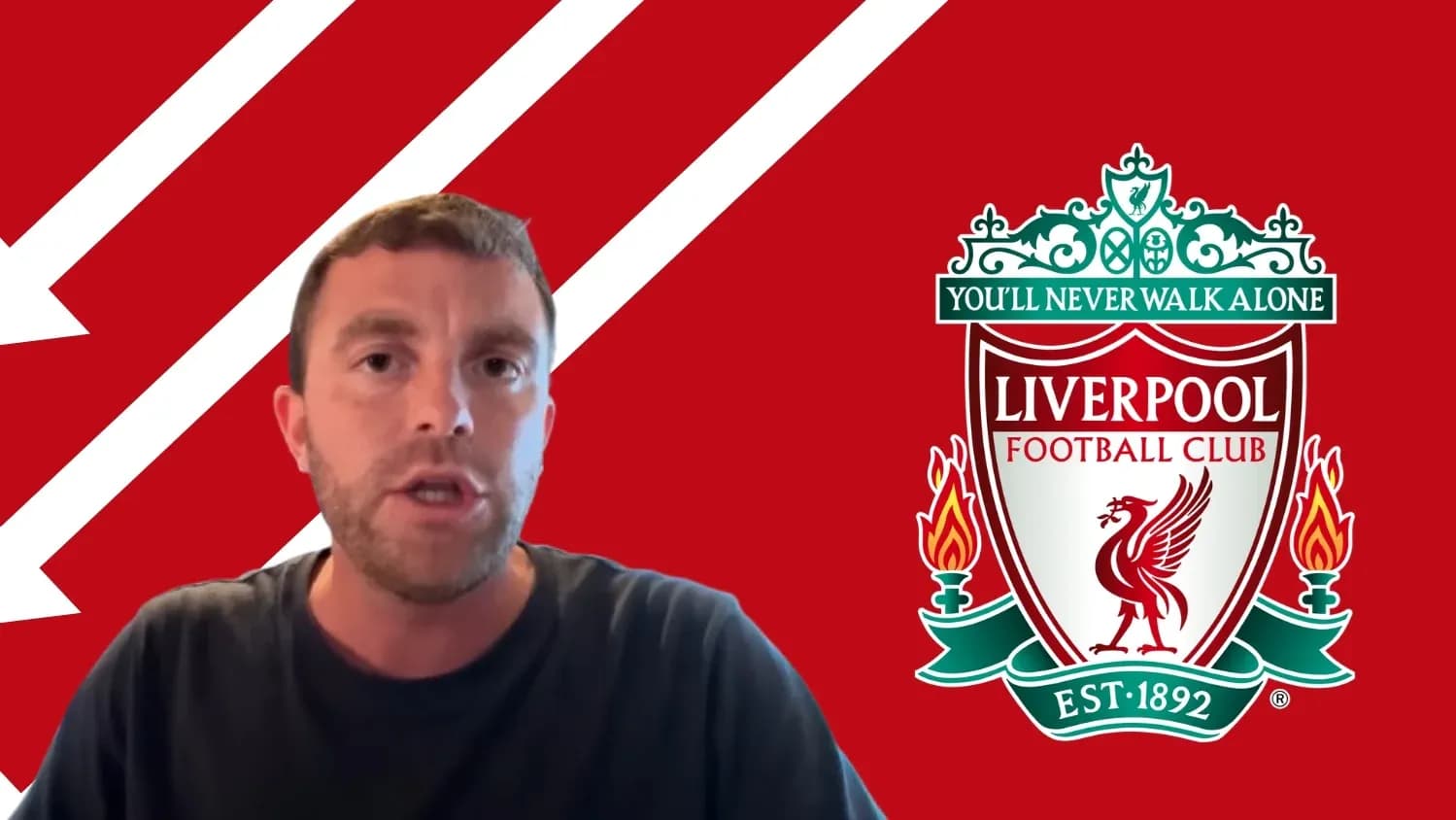 Man speaking with Liverpool FC logo in background