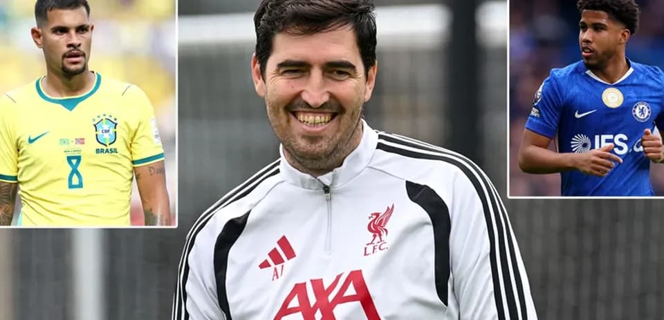 Liverpool coach smiling during training session