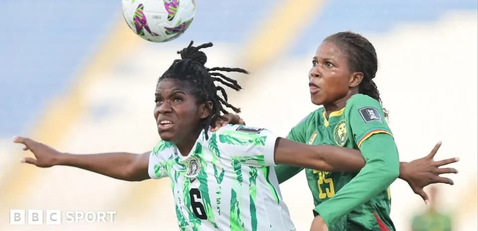 Two players contesting for the ball during match