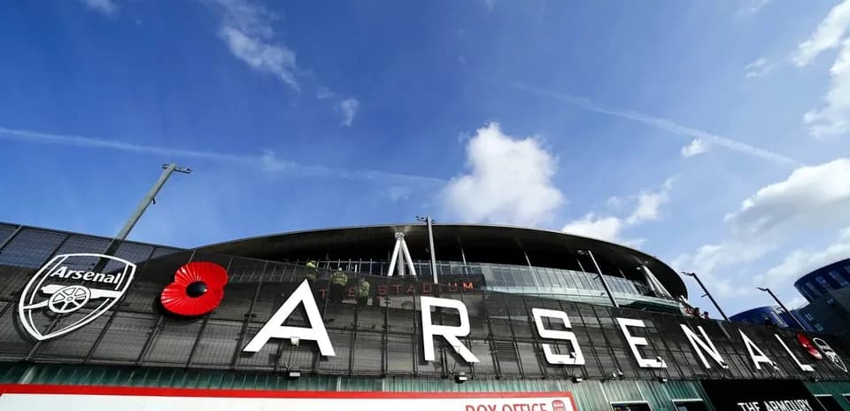 Arsenal Stadium entrance with club logo and poppy