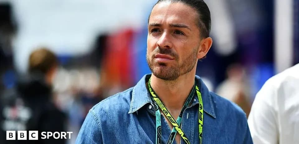 Man wearing denim shirt at motorsport event