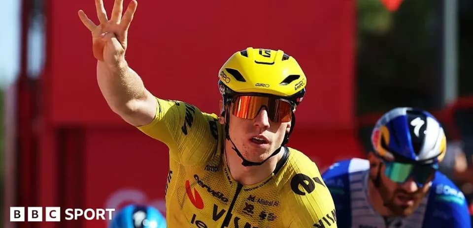 Biker in yellow jersey celebrating victory in race