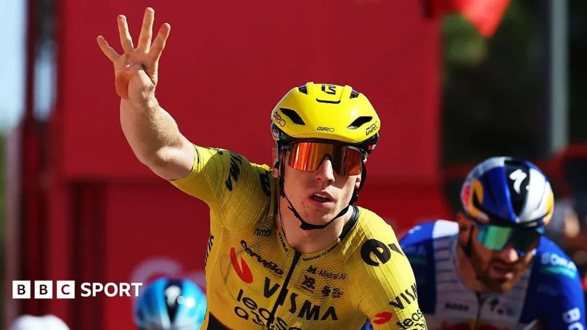 Biker in yellow jersey celebrating victory in race