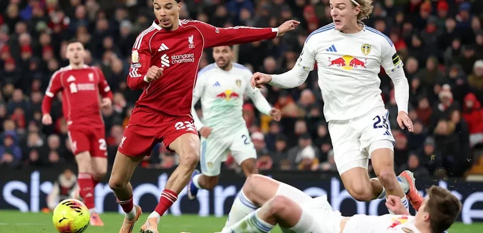 Liverpool and Leeds players in action during match