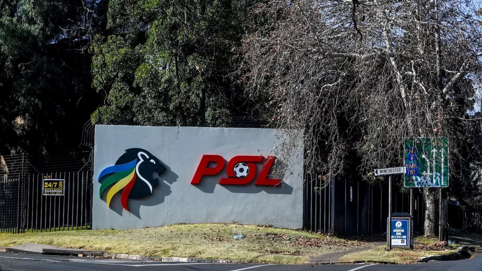 PSL logo on wall with street sign nearby