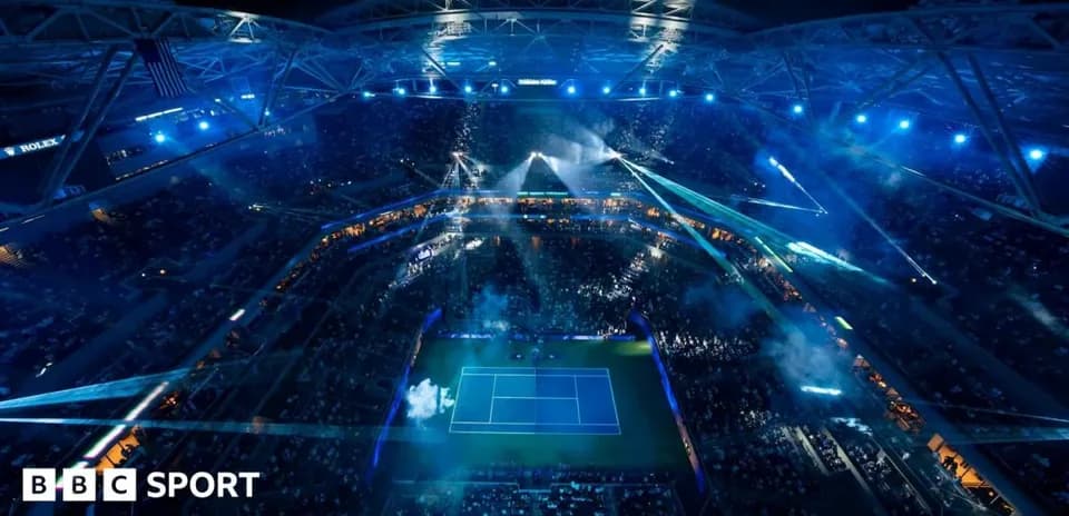 Tennis stadium illuminated during night match event