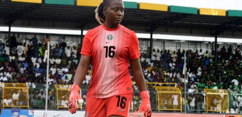 Goalkeeper walking on pitch during match