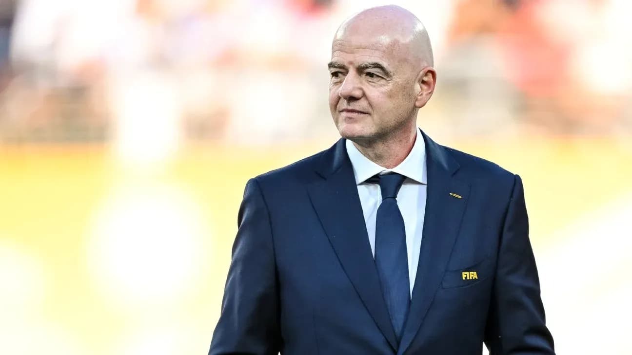 FIFA president walking on the pitch before match