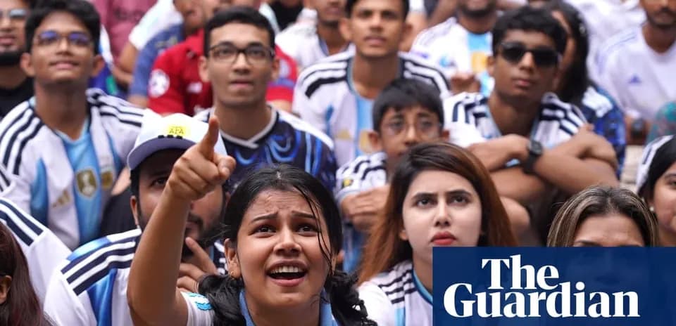 Argentinian fans watching a match with excitement