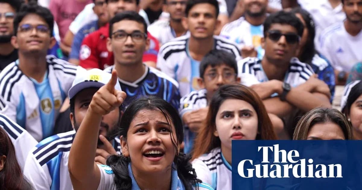 Argentinian fans watching a match with excitement