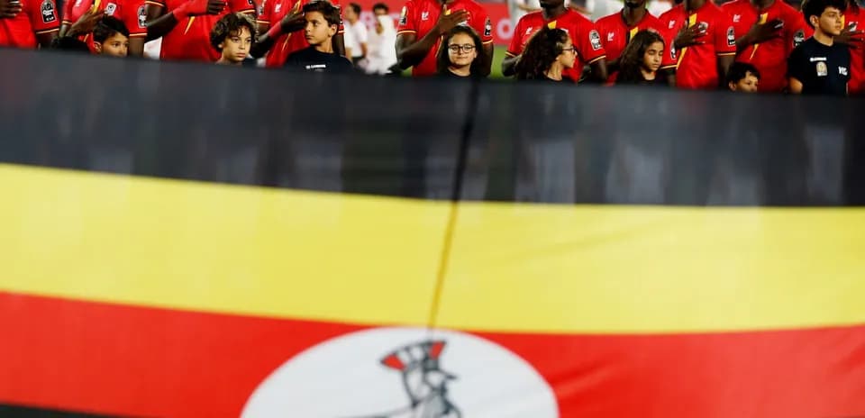 Ugandan players and children with national flag