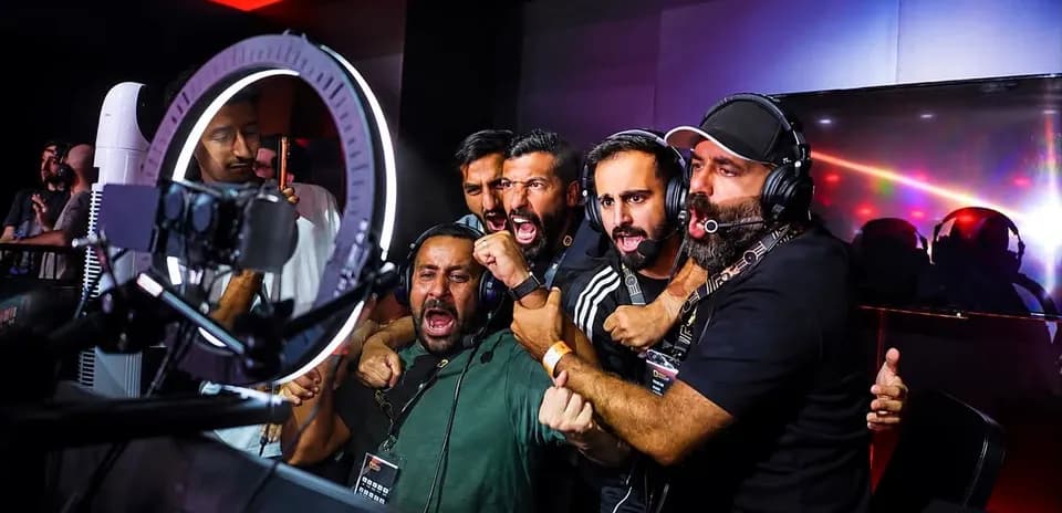 Commentators celebrating during esports event broadcast