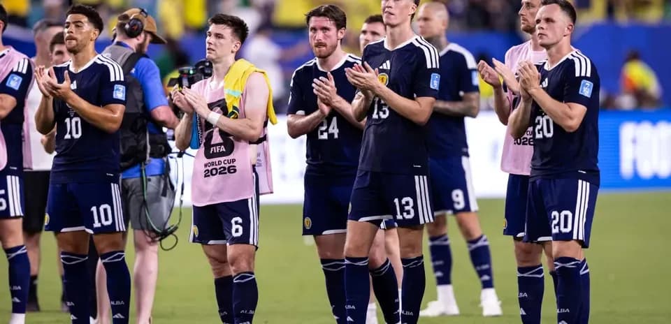 Scotland players applauding fans after match