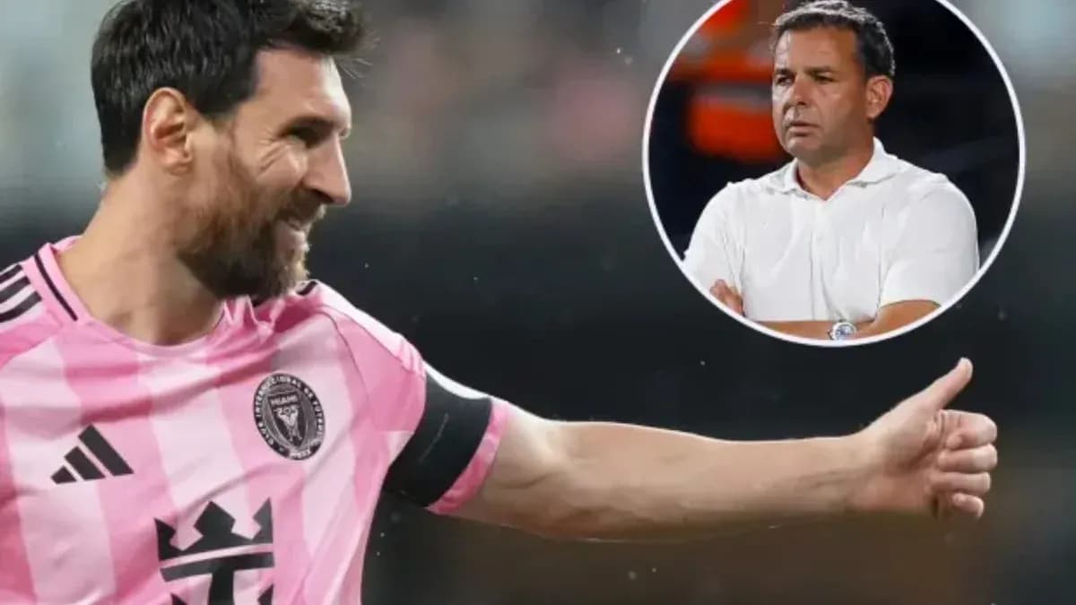 Lionel Messi celebrating during a match with coach in background