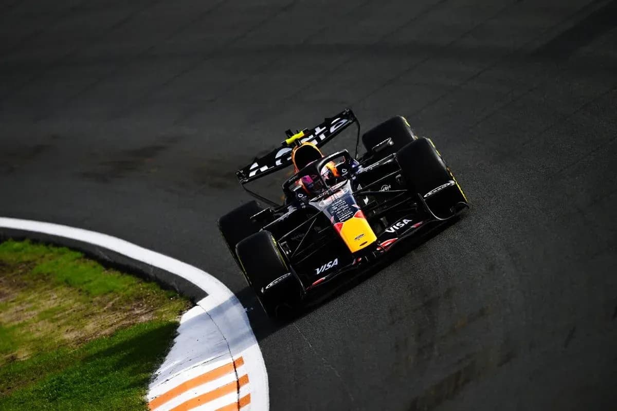 Formula 1 car navigating a track corner