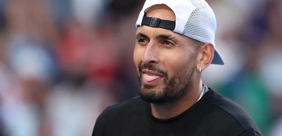 Tennis player smiling with cap during match