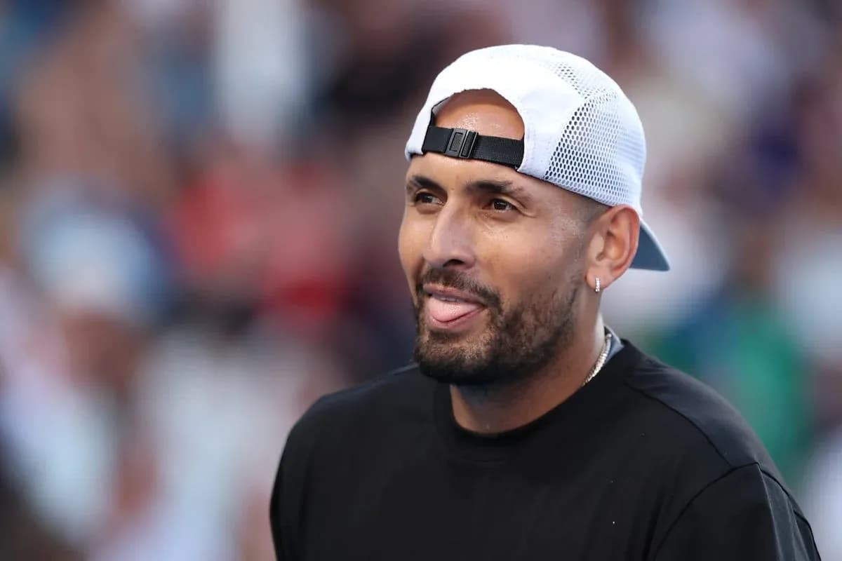 Tennis player smiling with cap during match