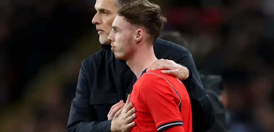 Coach speaking to player during match substitution