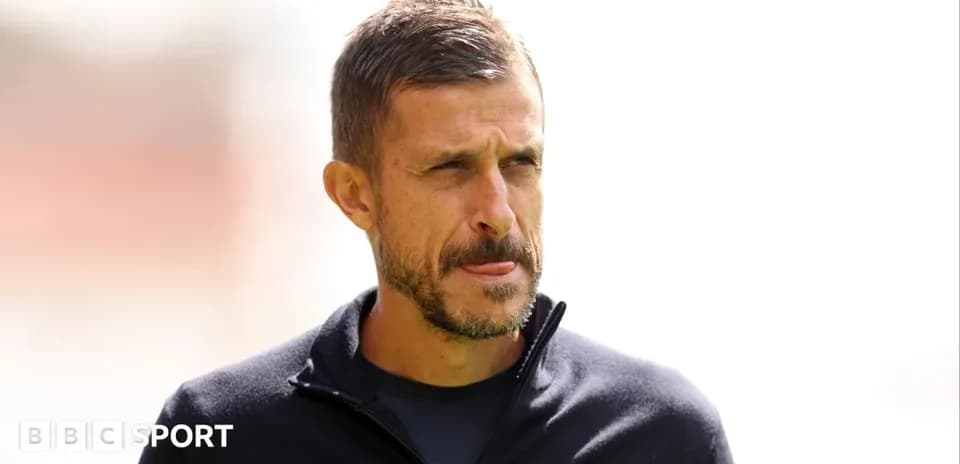 Coach observing from the sidelines during training