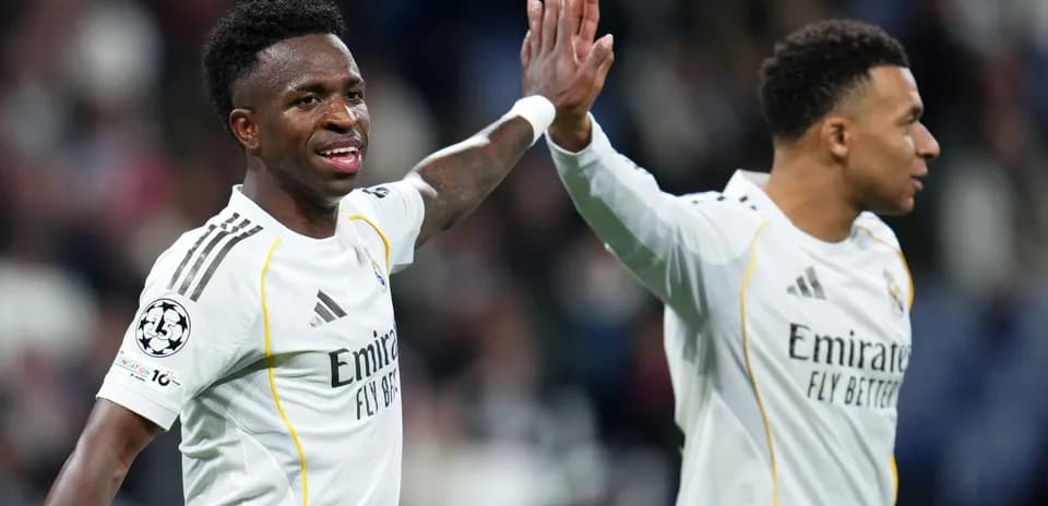 Vinícius Júnior celebrating with teammate during match